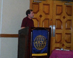 Michael Swanson, technical manager, Information Technology Department, U.S. Naval Hospital, Okinawa, addresses the chapter in August.